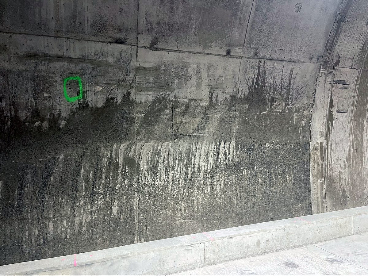 Stained and streaked tunnel wall before remedial work