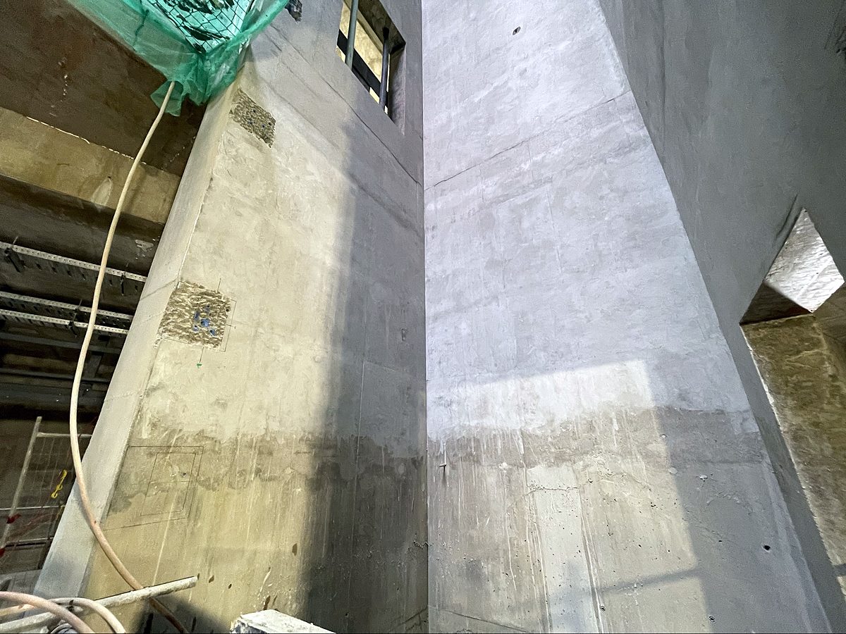 Repaired and resurfaced concrete walls in a tunnel shaft