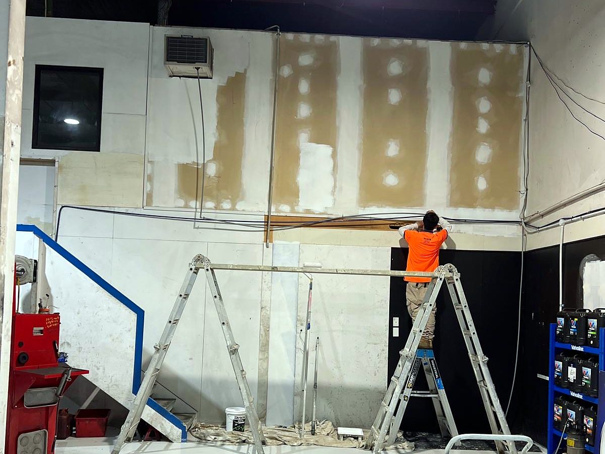 Painter preparing the workshop walls