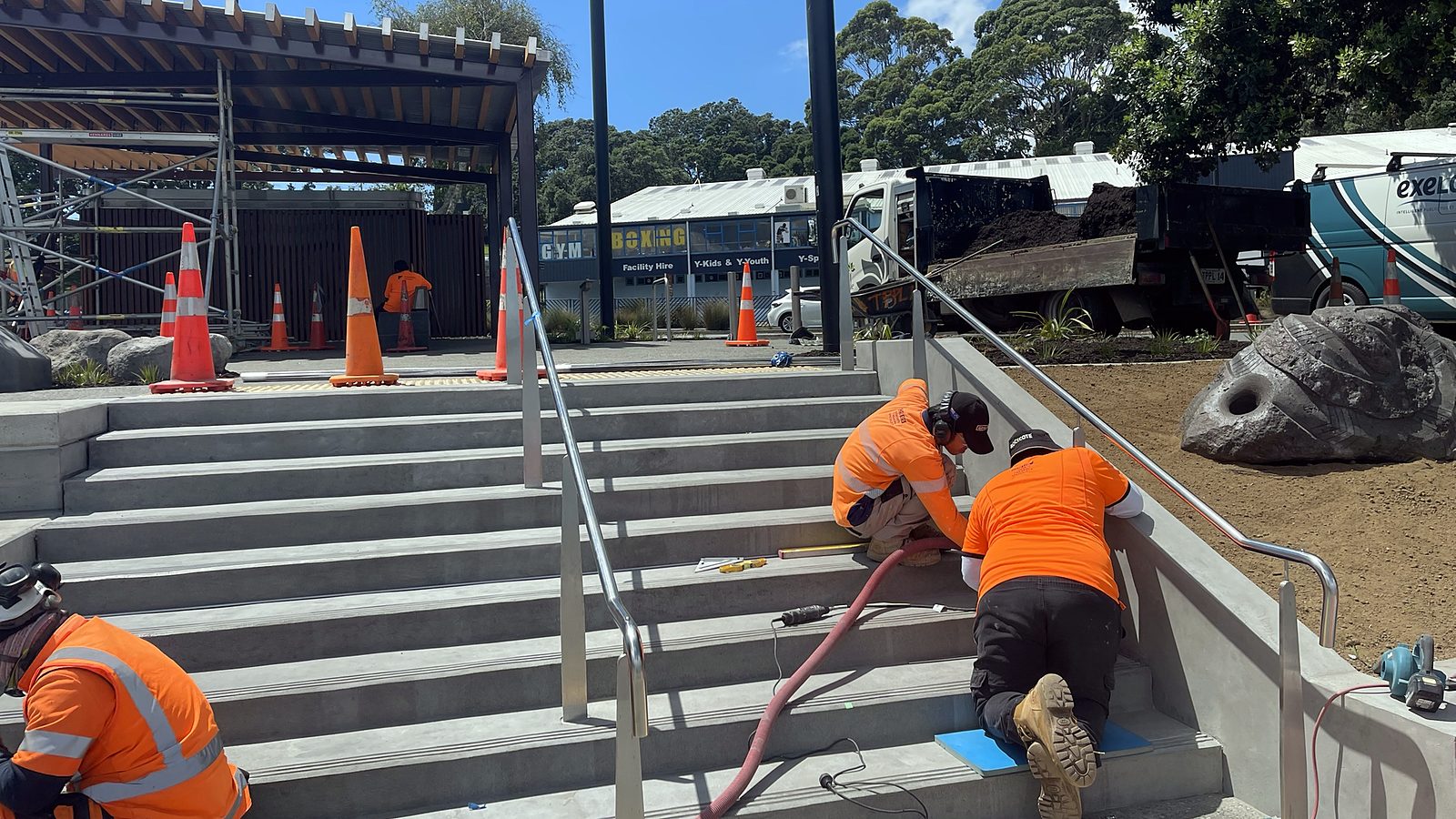 CSIS team working on the concrete steps at the Panmure public space