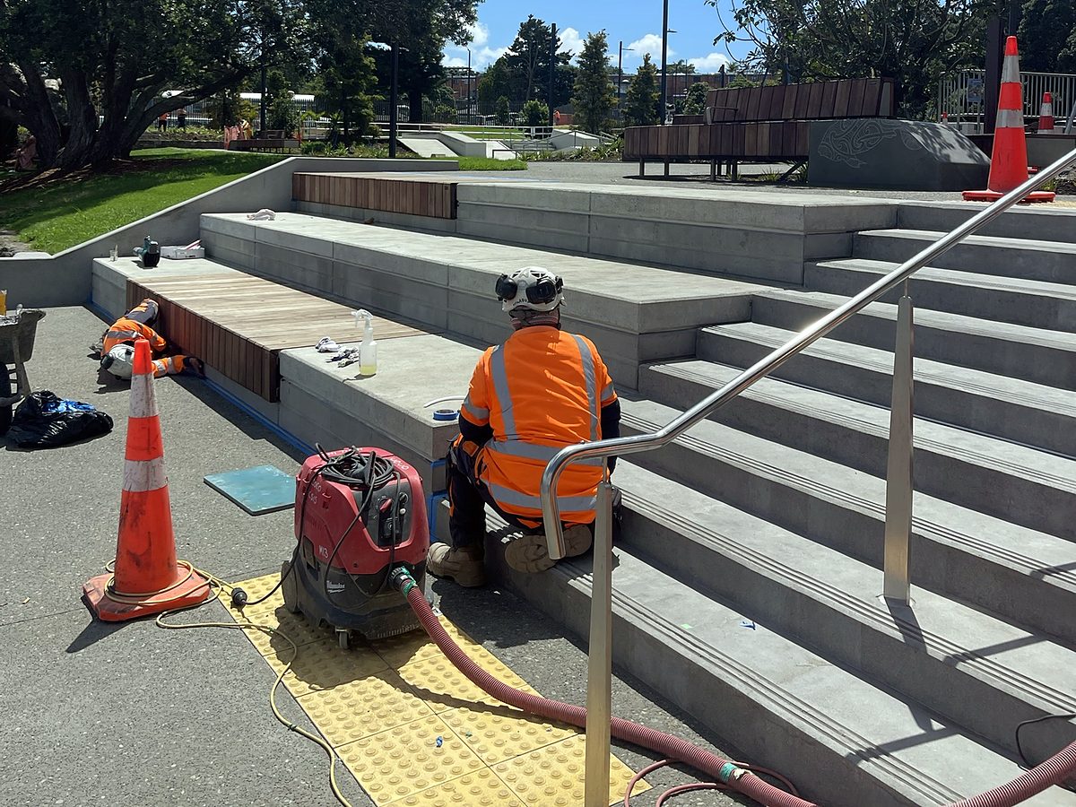 Team member working along the edge of the concrete steps