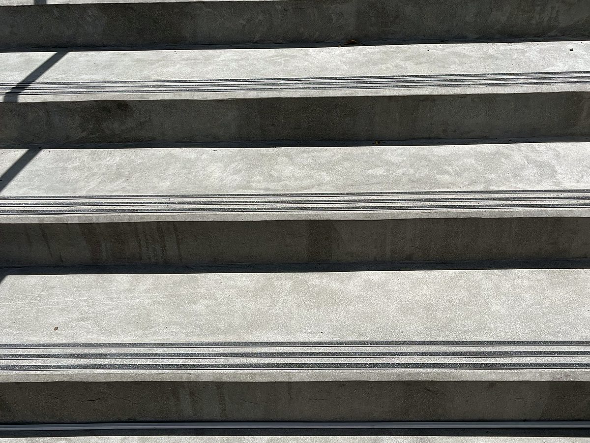 Finished concrete stair treads with anti-slip nosings