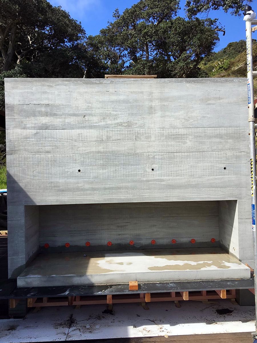 Board-formed concrete outdoor feature wall