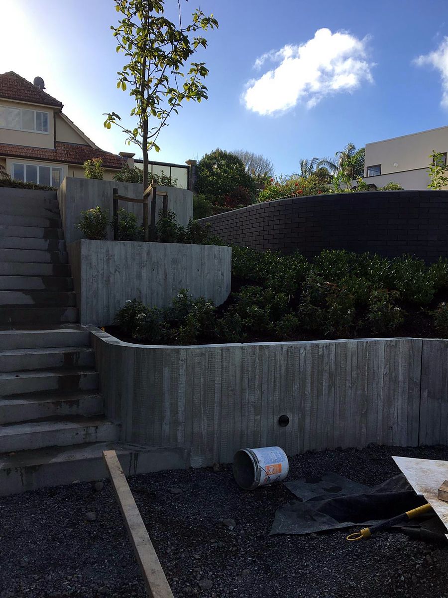 Tiered board-formed retaining walls and stairs